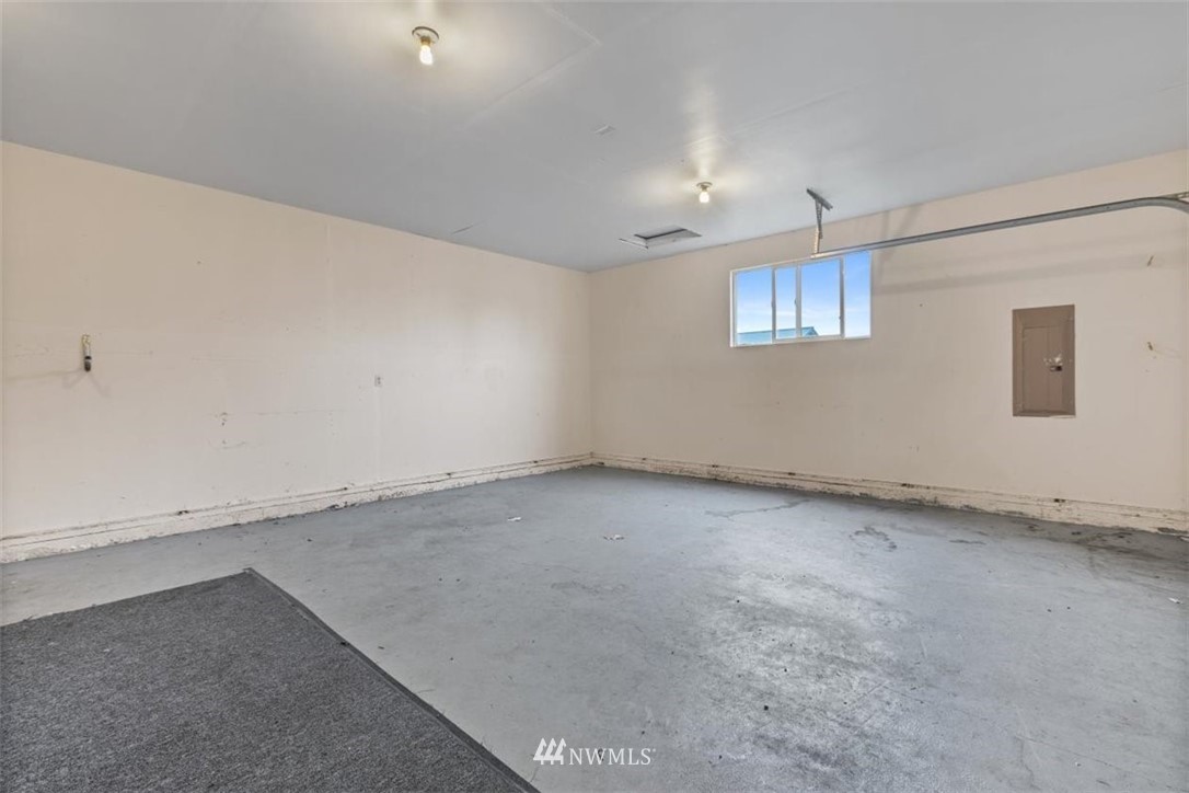 17923 Charlotte Place Southwest Rochester, WA 98579 - Photo 22 of 24 an empty room with a empty space and windows