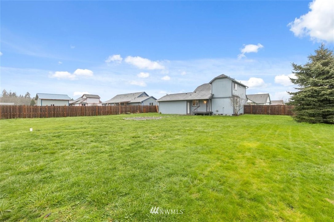 17923 Charlotte Place Southwest Rochester, WA 98579 - Photo 24 of 24 a view of a house with a yard and a large tree