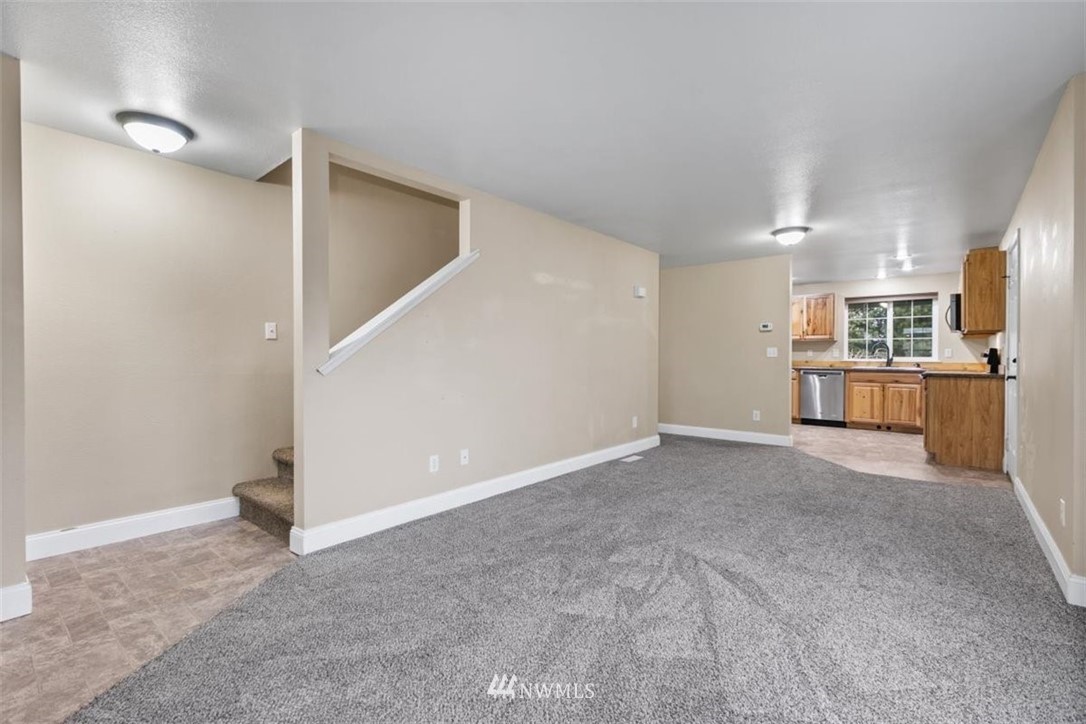 17923 Charlotte Place Southwest Rochester, WA 98579 - Photo 6 of 24 a view of a kitchen with a sink and a refrigerator