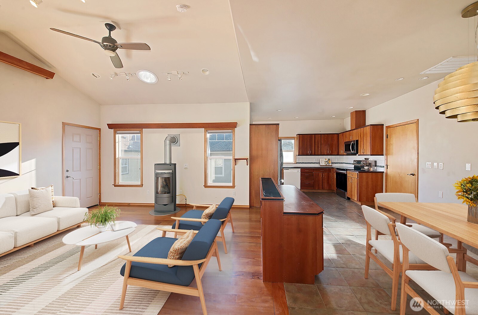 1752 Lee Court, Unit 5 Freeland, WA 98249 - Photo 12 of 38 a living room with furniture kitchen view and a chandelier