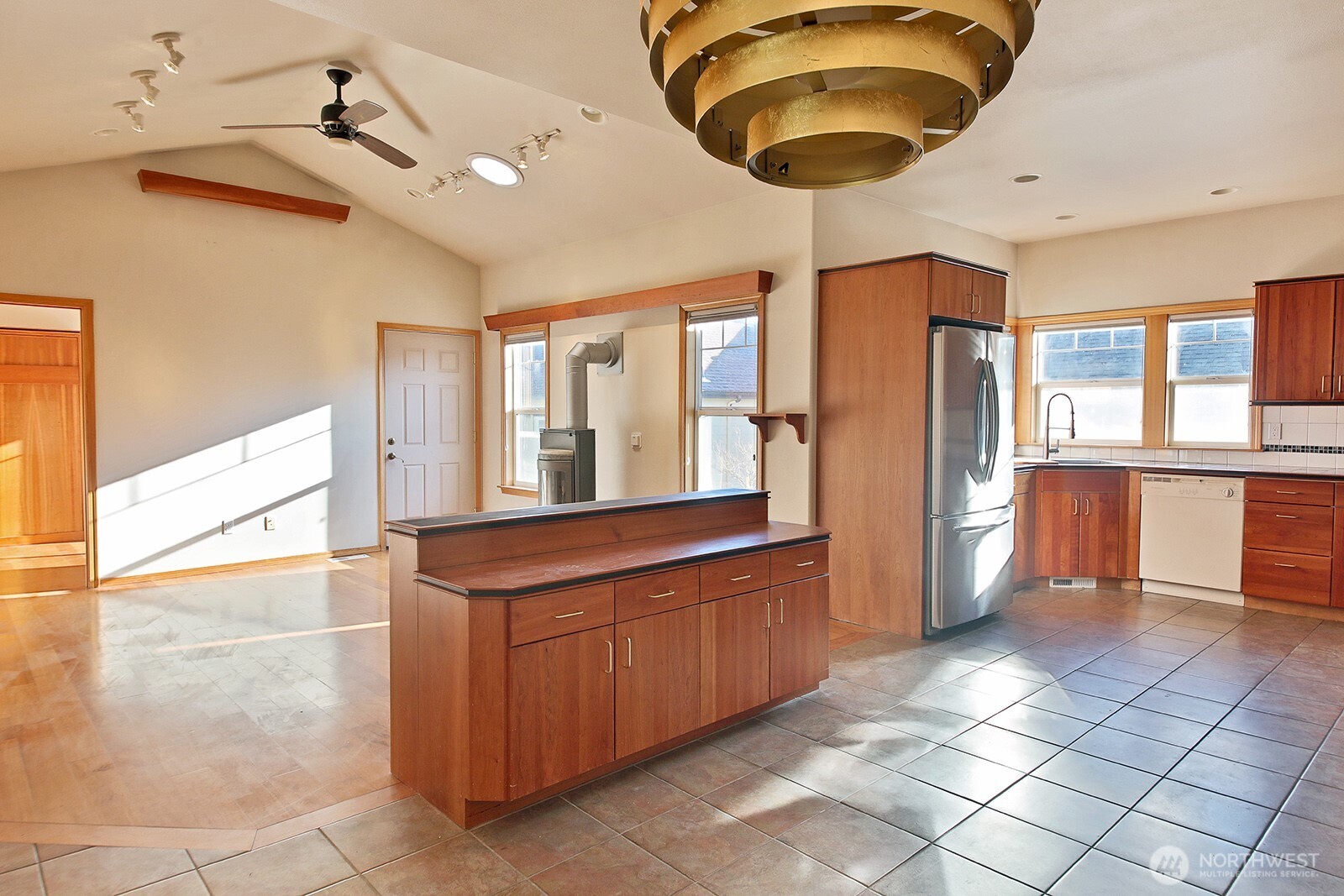 1752 Lee Court, Unit 5 Freeland, WA 98249 - Photo 18 of 38 a kitchen with stainless steel appliances granite countertop a sink and a refrigerator