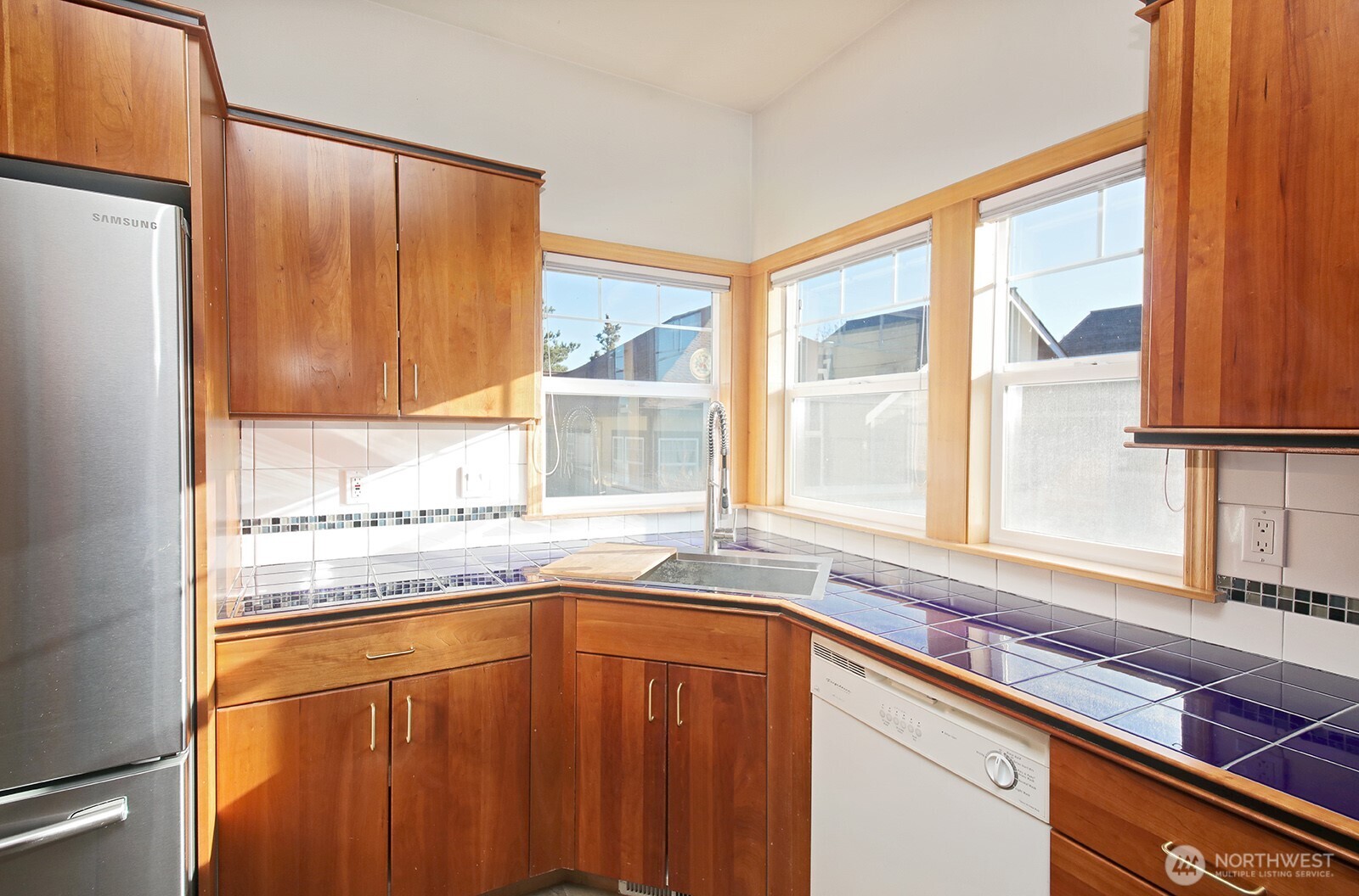1752 Lee Court, Unit 5 Freeland, WA 98249 - Photo 22 of 38 a kitchen with stainless steel appliances cabinets and a window