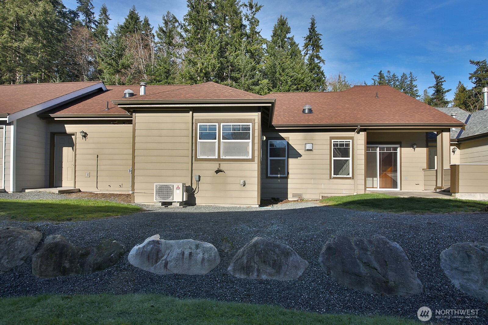 1752 Lee Court, Unit 5 Freeland, WA 98249 - Photo 5 of 38 a front view of a house with a yard