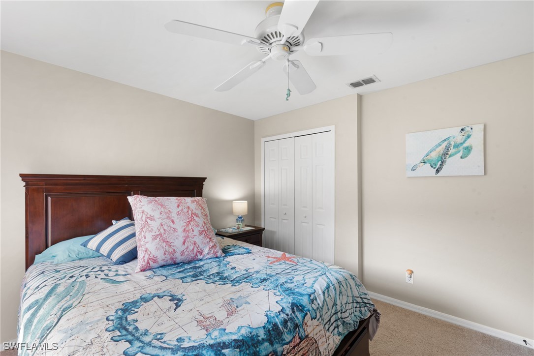 3307 Southwest 2nd Avenue Cape Coral, FL 33914 - Photo 19 of 39 a bedroom with a bed and a painting on the wall