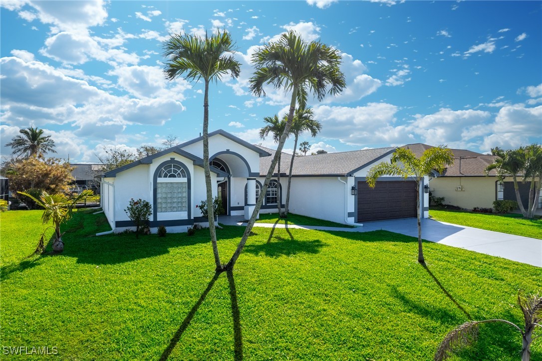 3307 Southwest 2nd Avenue Cape Coral, FL 33914 - Photo 35 of 39 a house view with a garden space