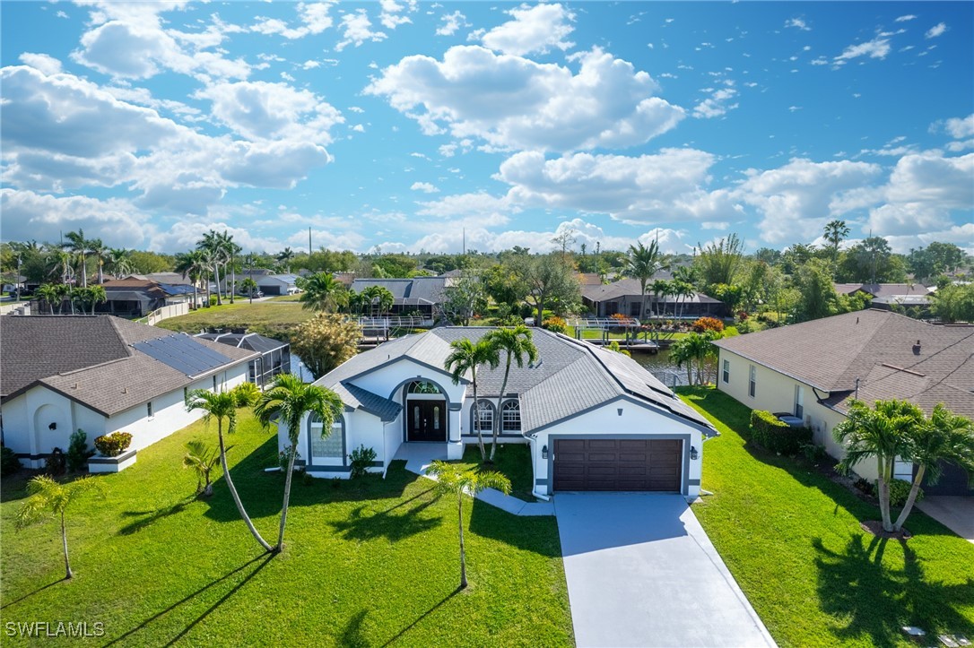 3307 Southwest 2nd Avenue Cape Coral, FL 33914 - Photo 37 of 39 a aerial view of a house with table and chairs