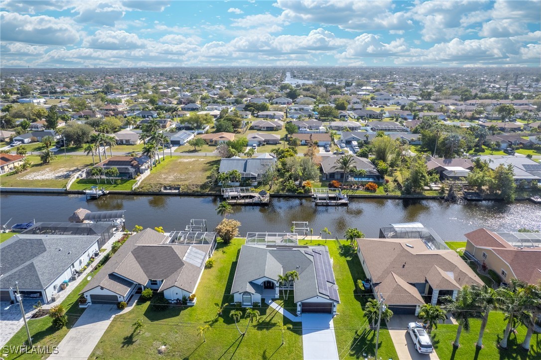 3307 Southwest 2nd Avenue Cape Coral, FL 33914 - Photo 39 of 39 an aerial view of a house with a lake view