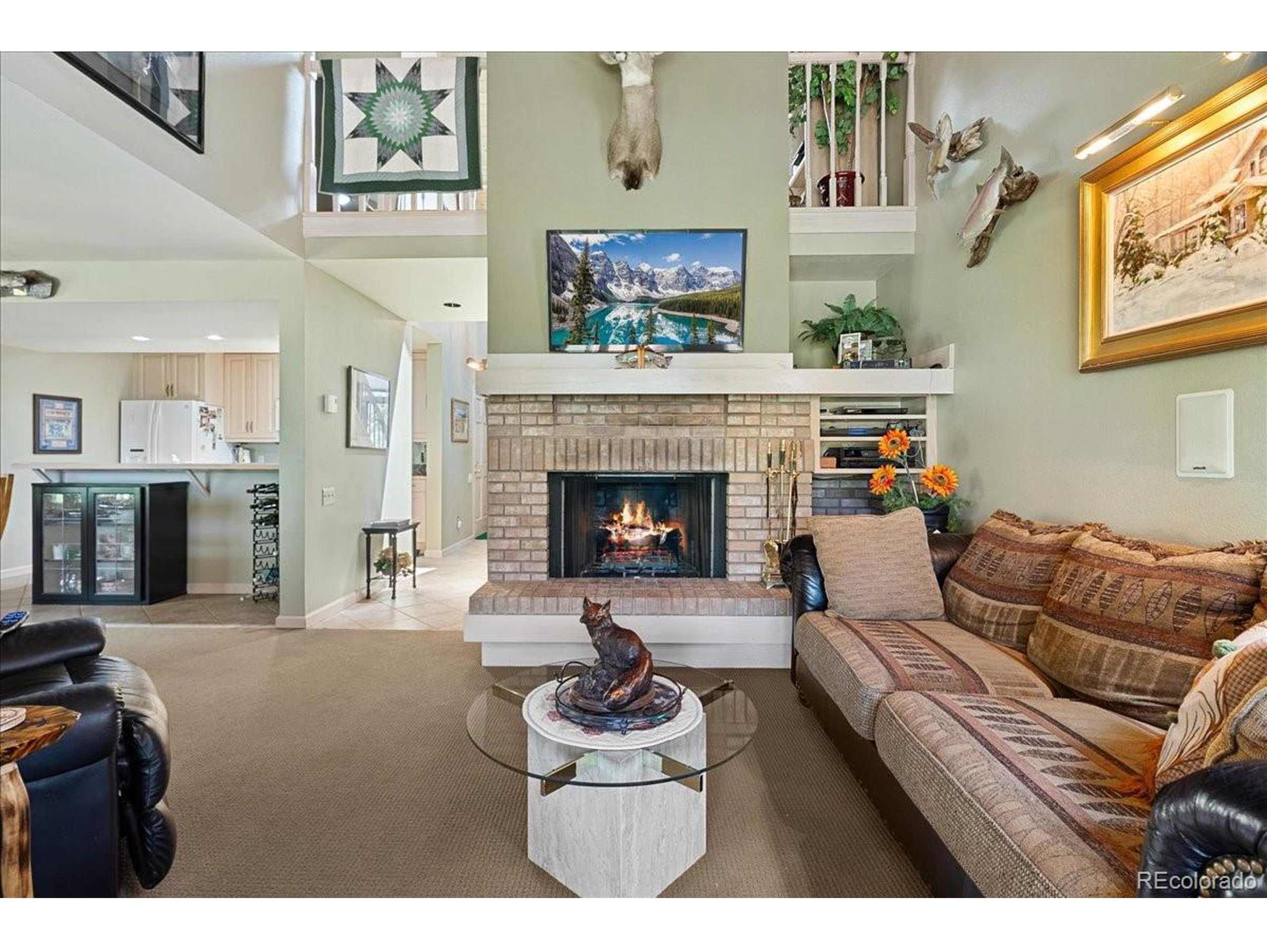 40 Three Lks Court Red Feather Lakes, CO 80545 - Photo 12 of 48 a living room with furniture and a fireplace