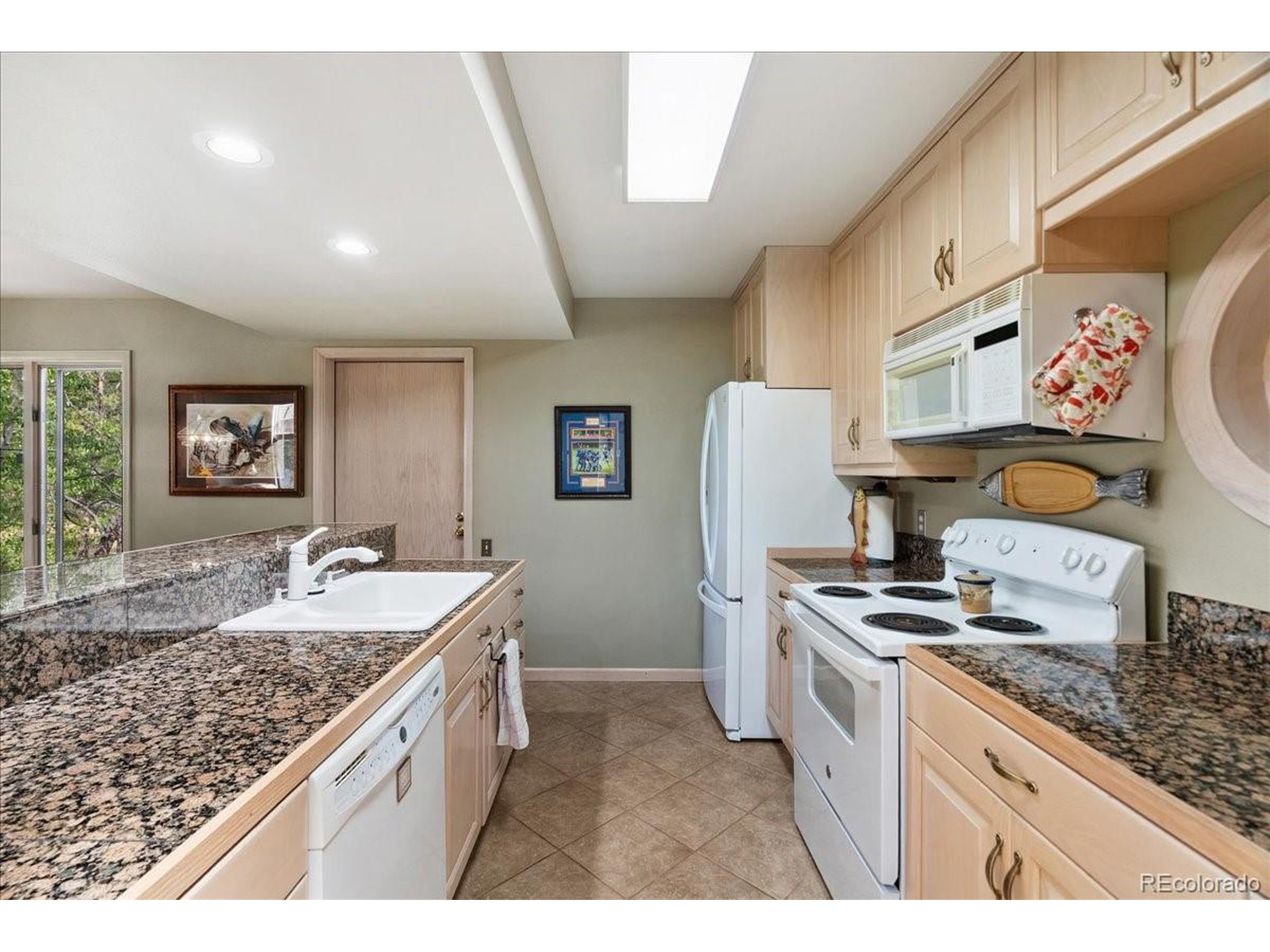 40 Three Lks Court Red Feather Lakes, CO 80545 - Photo 15 of 48 a kitchen with stainless steel appliances granite countertop a sink stove and refrigerator