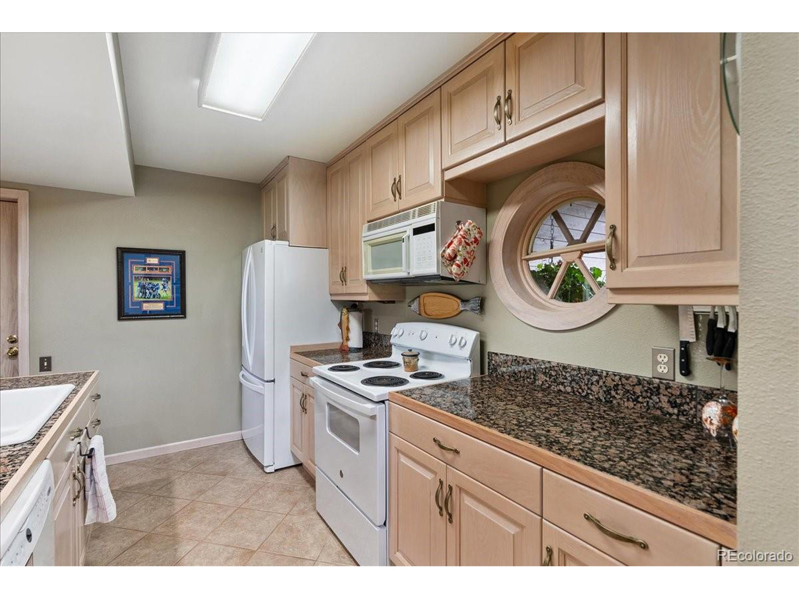 40 Three Lks Court Red Feather Lakes, CO 80545 - Photo 16 of 48 a kitchen with stainless steel appliances granite countertop a stove and a refrigerator