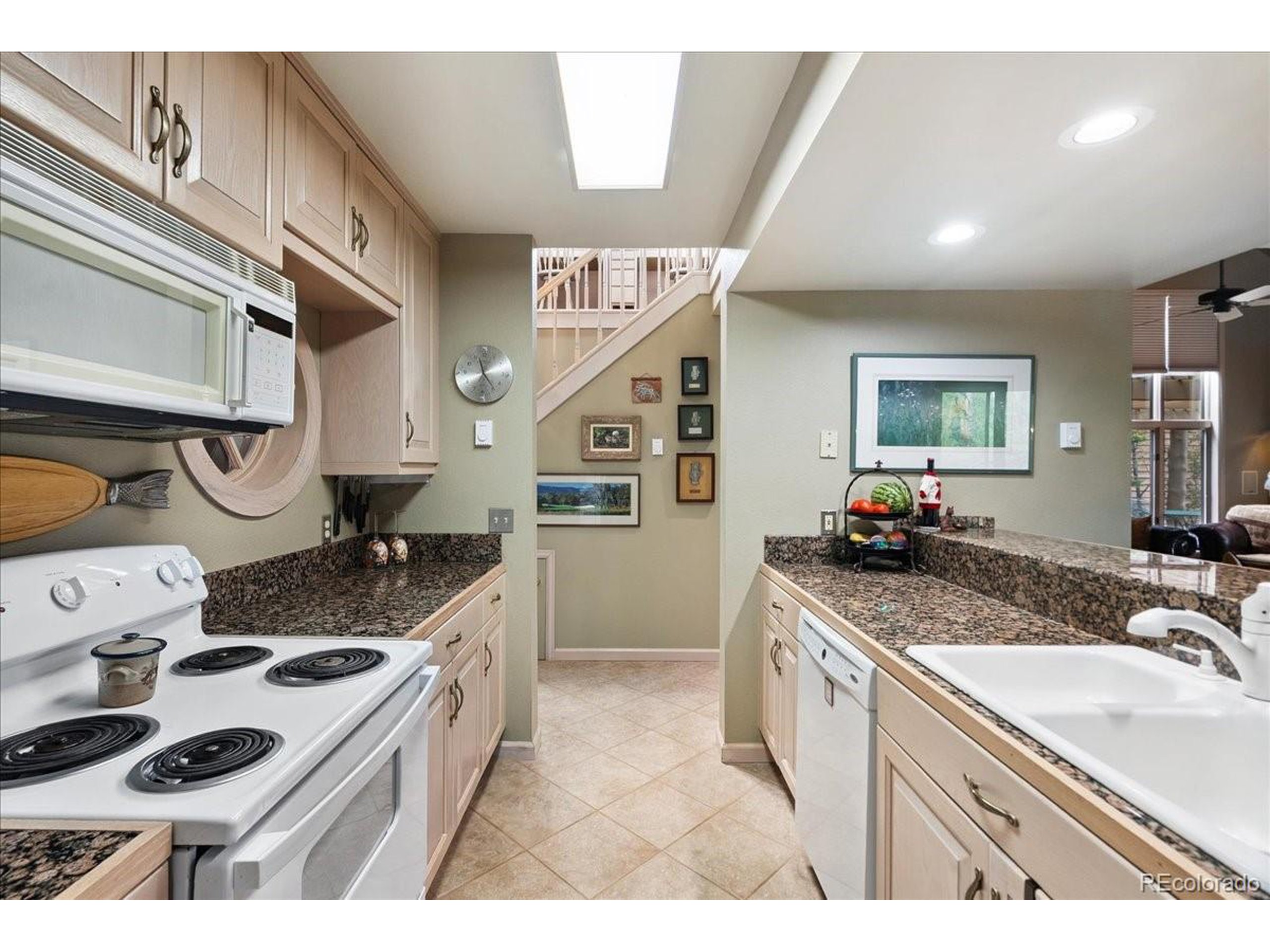 40 Three Lks Court Red Feather Lakes, CO 80545 - Photo 17 of 48 a kitchen with a stove a sink and a refrigerator