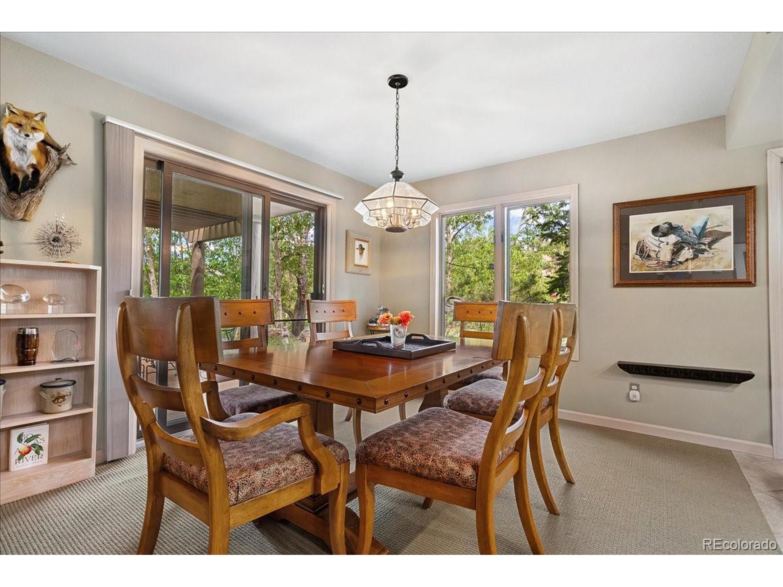 40 Three Lks Court Red Feather Lakes, CO 80545 - Photo 18 of 48 a view of a dining room with furniture window and outside view