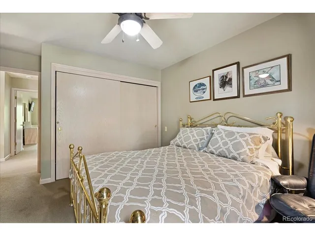 a bed room with a bed and a window