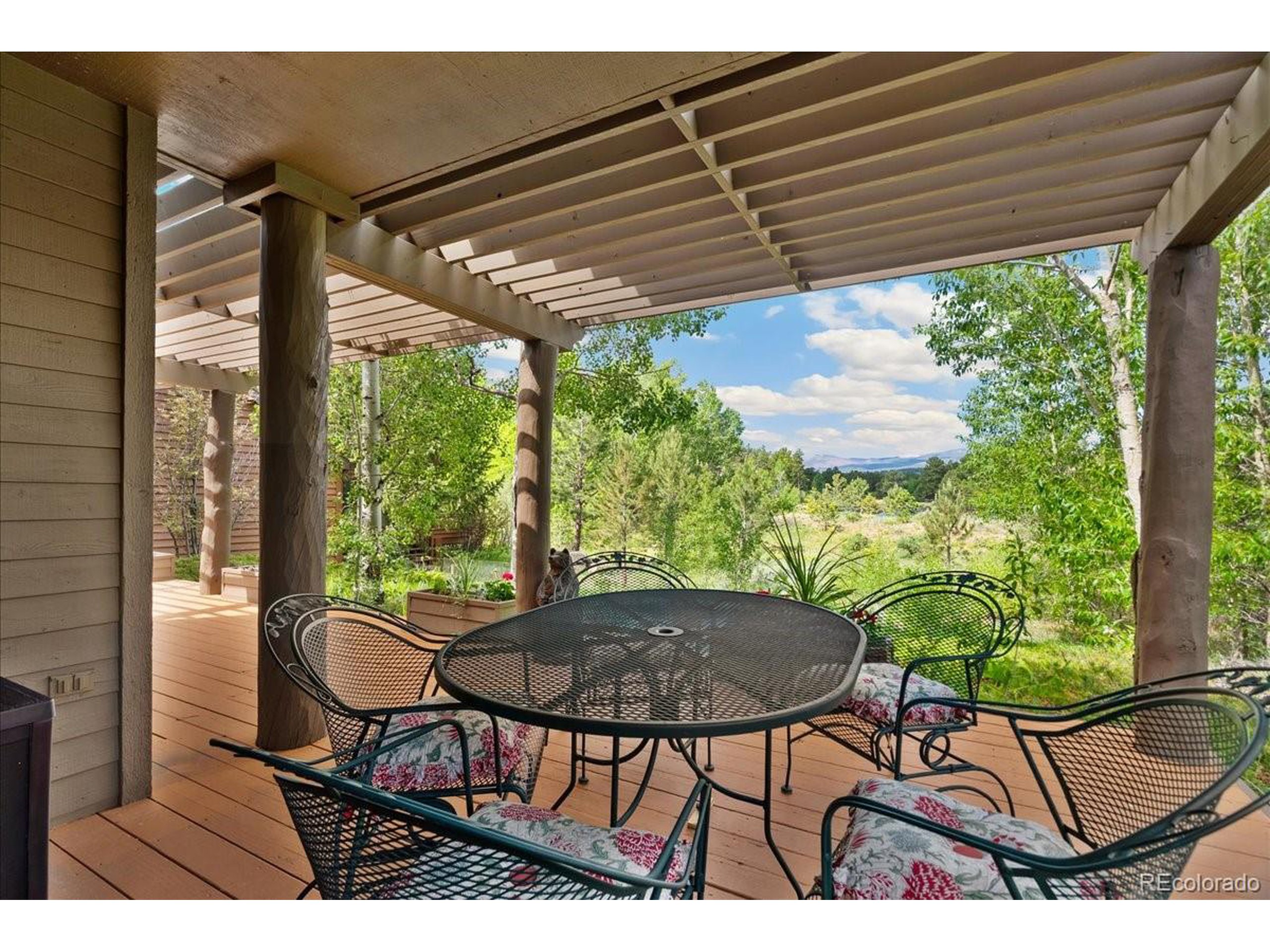 40 Three Lks Court Red Feather Lakes, CO 80545 - Photo 3 of 48 a view of a outdoor sitting area with furniture