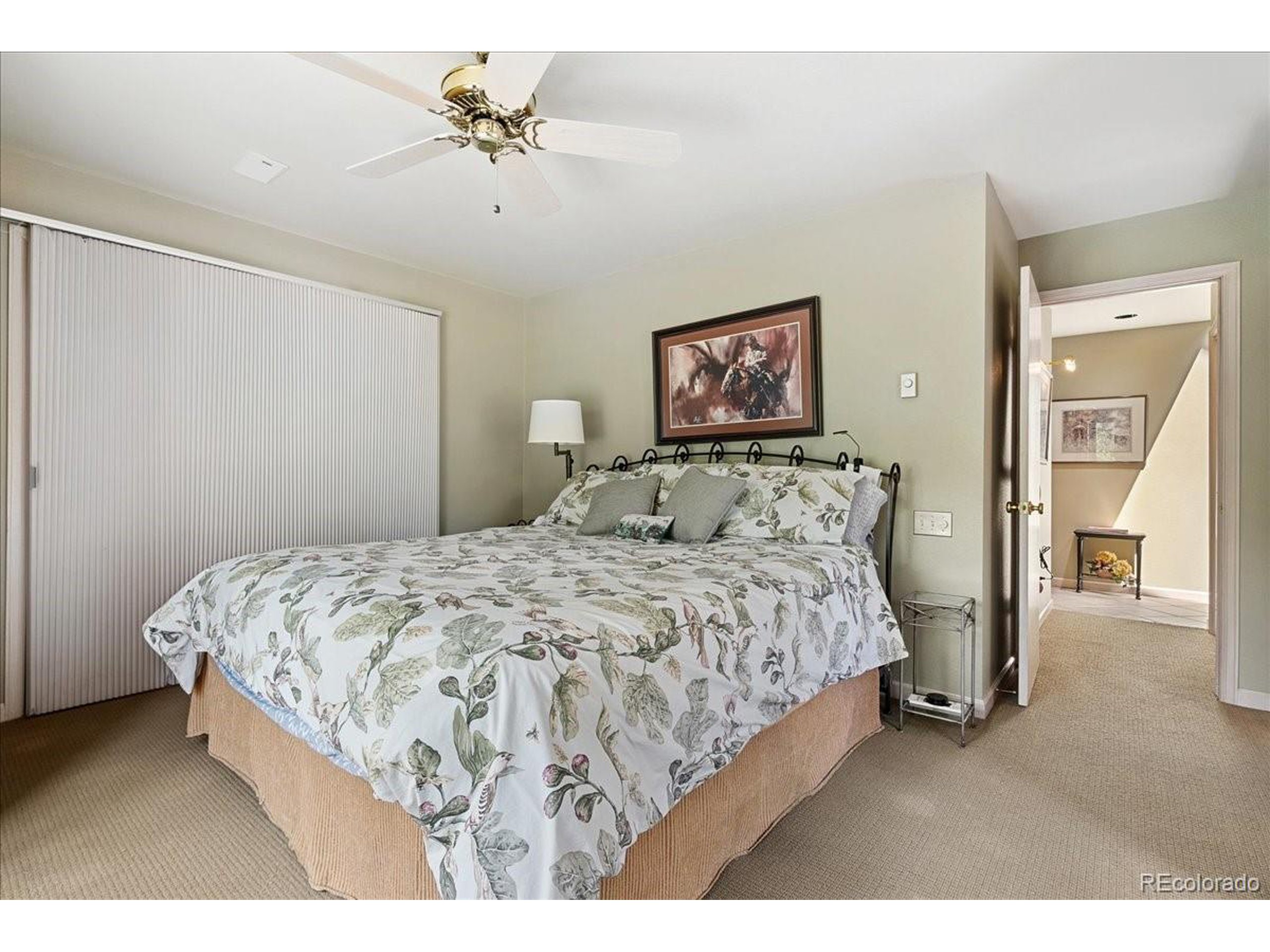 40 Three Lks Court Red Feather Lakes, CO 80545 - Photo 33 of 48 a bedroom with a bed and a painting on the wall