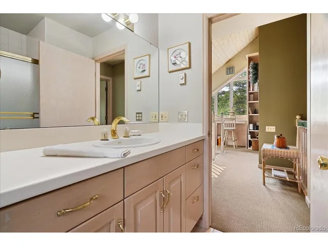 a bedroom with a bed window and couch