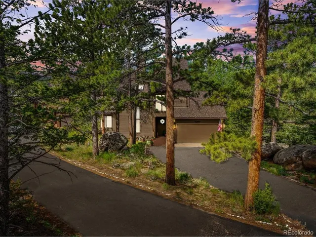 a view of a house with a tree