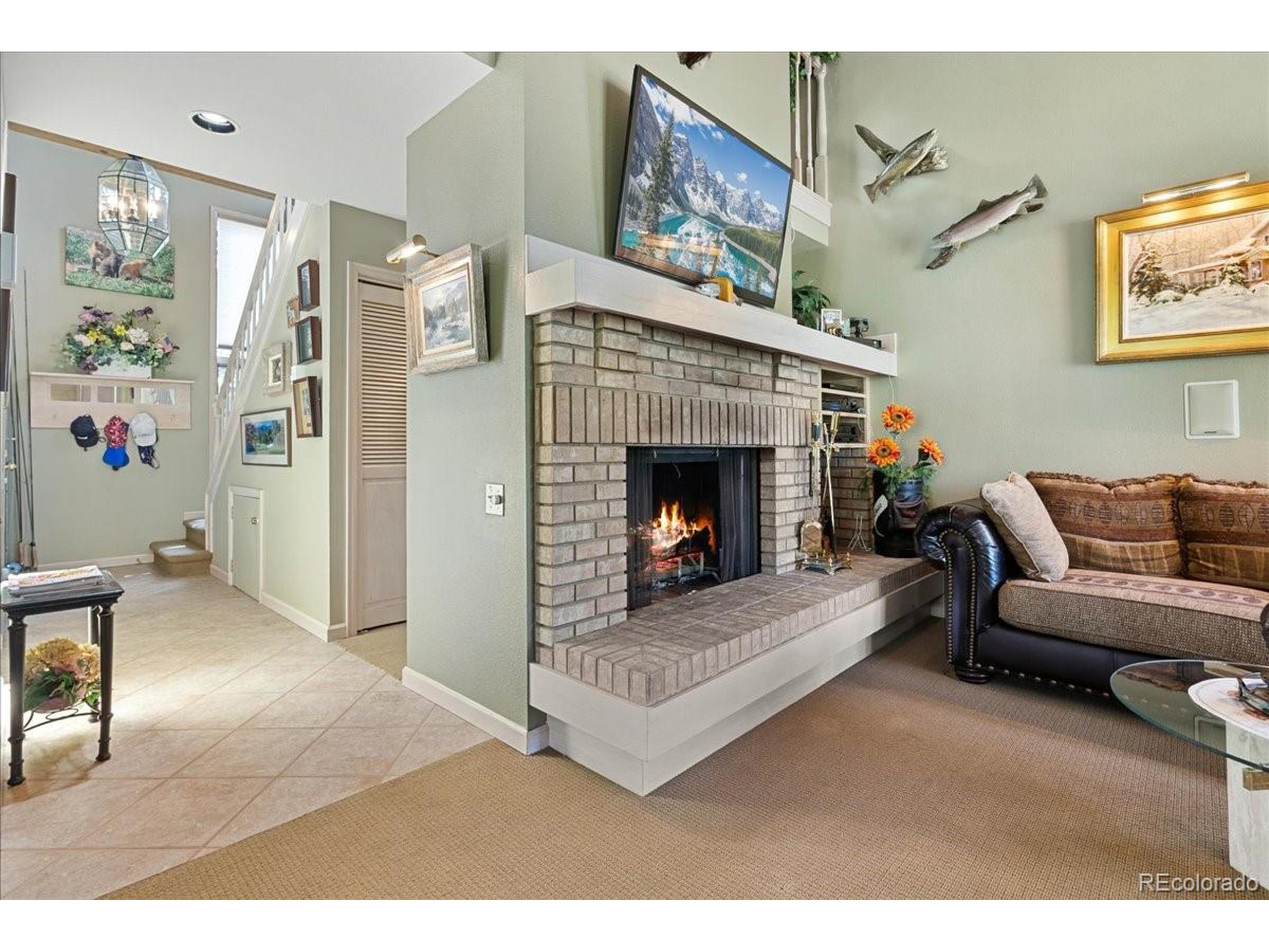 40 Three Lks Court Red Feather Lakes, CO 80545 - Photo 5 of 48 a living room with furniture and a fireplace
