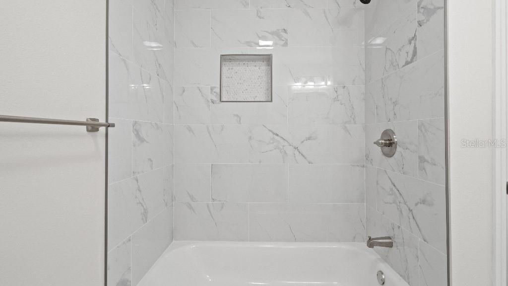 1024 Spindle Palm Way Apollo Beach, FL 33572 - Photo 2 of 50 a bathroom with a shower
