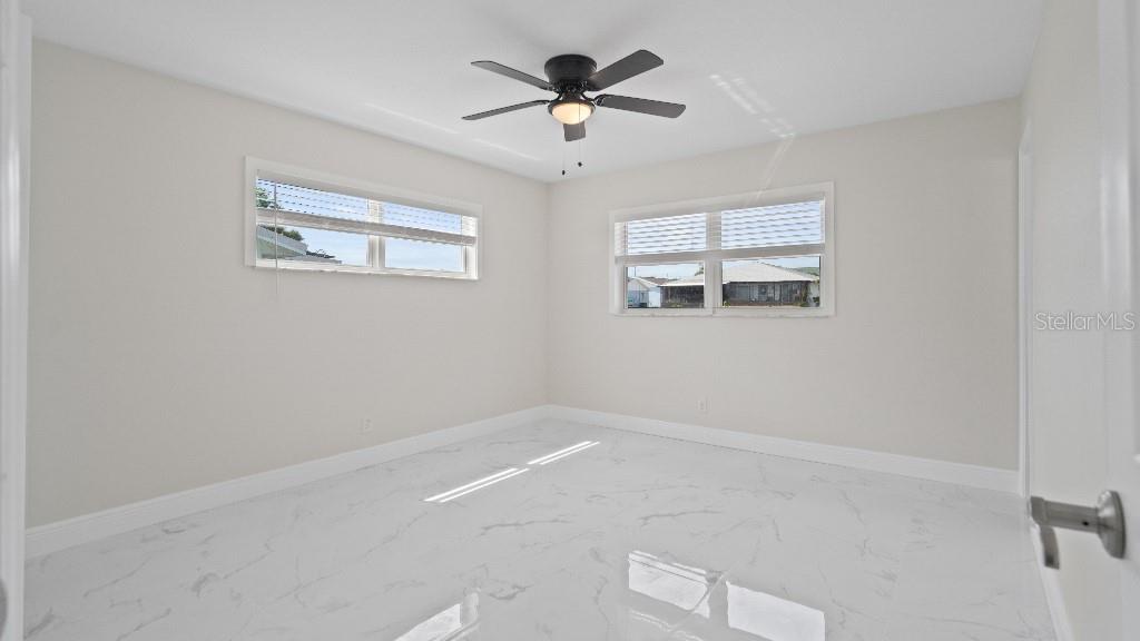 1024 Spindle Palm Way Apollo Beach, FL 33572 - Photo 22 of 50 a view of an empty room with a window