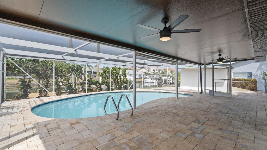 1024 Spindle Palm Way Apollo Beach, FL 33572 - Photo 25 of 50 a view of a swimming pool with a porch