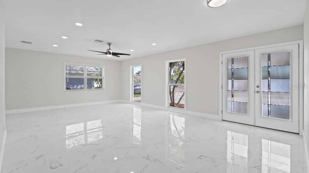 1024 Spindle Palm Way Apollo Beach, FL 33572 - Photo 3 of 50 a view of an empty room with a window