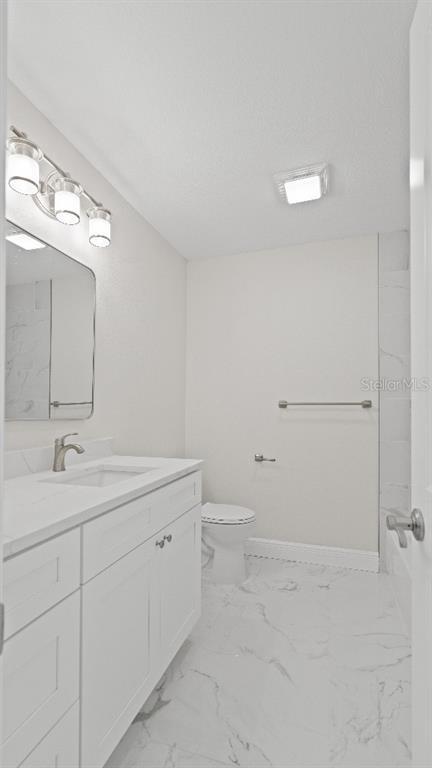 1024 Spindle Palm Way Apollo Beach, FL 33572 - Photo 36 of 50 a bathroom with a double vanity sink and mirror