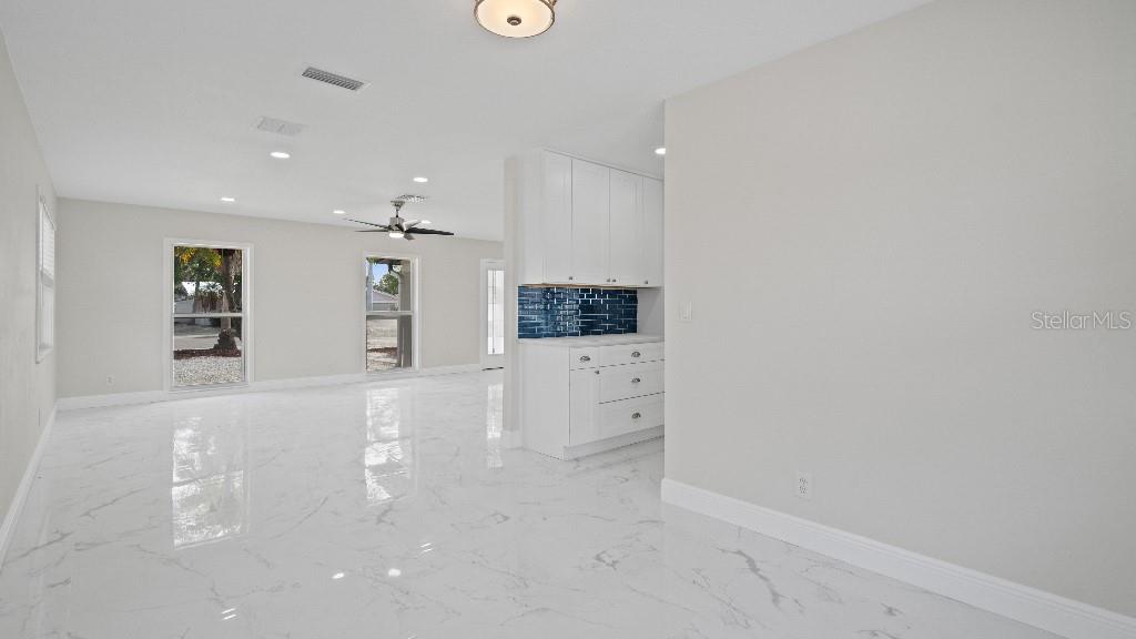 1024 Spindle Palm Way Apollo Beach, FL 33572 - Photo 38 of 50 en empty room with windows and cabinet