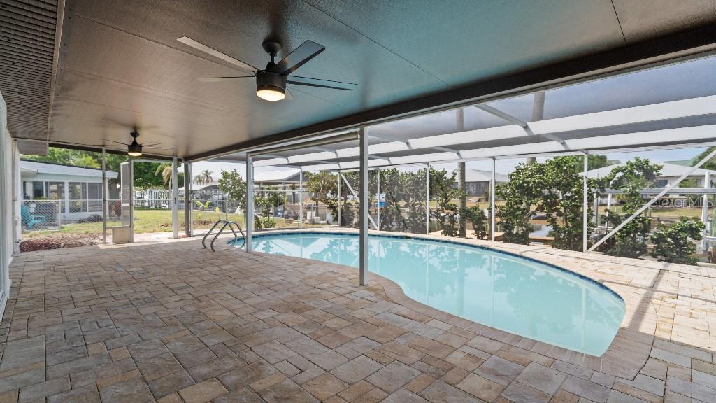 1024 Spindle Palm Way Apollo Beach, FL 33572 - Photo 45 of 50 a view of a swimming pool with a porch