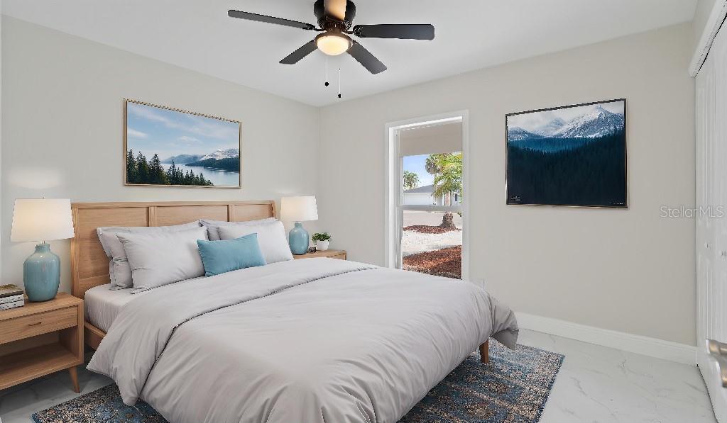 1024 Spindle Palm Way Apollo Beach, FL 33572 - Photo 46 of 50 a bedroom with a bed and a painting on the wall