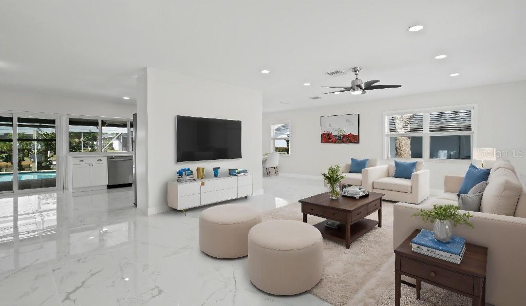 1024 Spindle Palm Way Apollo Beach, FL 33572 - Photo 47 of 50 a living room with furniture and a flat screen tv