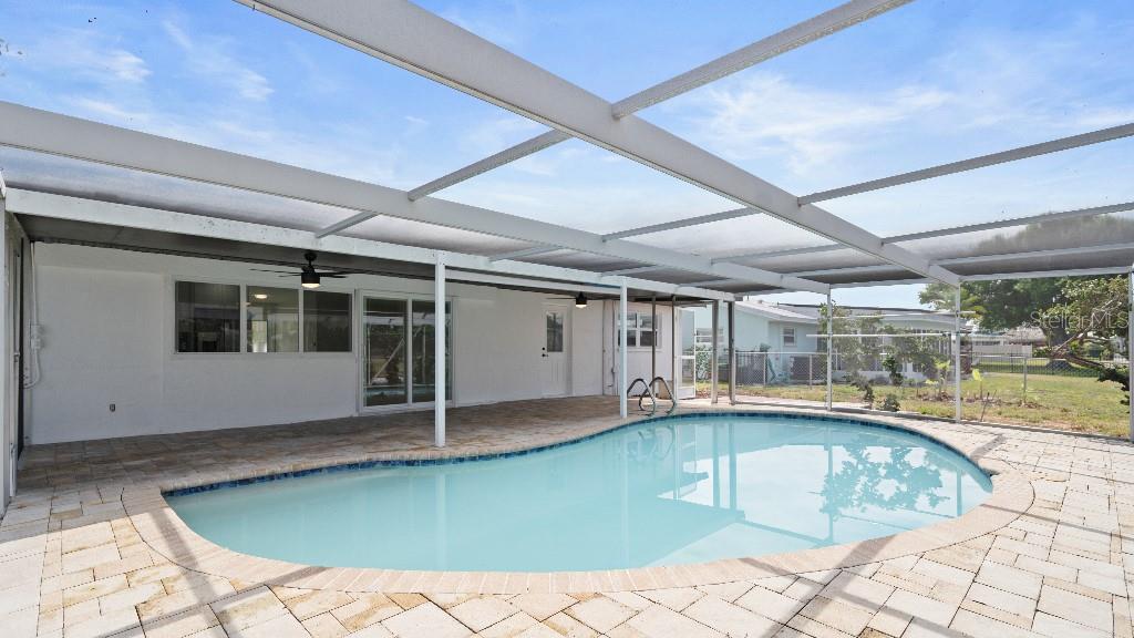 1024 Spindle Palm Way Apollo Beach, FL 33572 - Photo 8 of 50 a view of a patio with a swimming pool