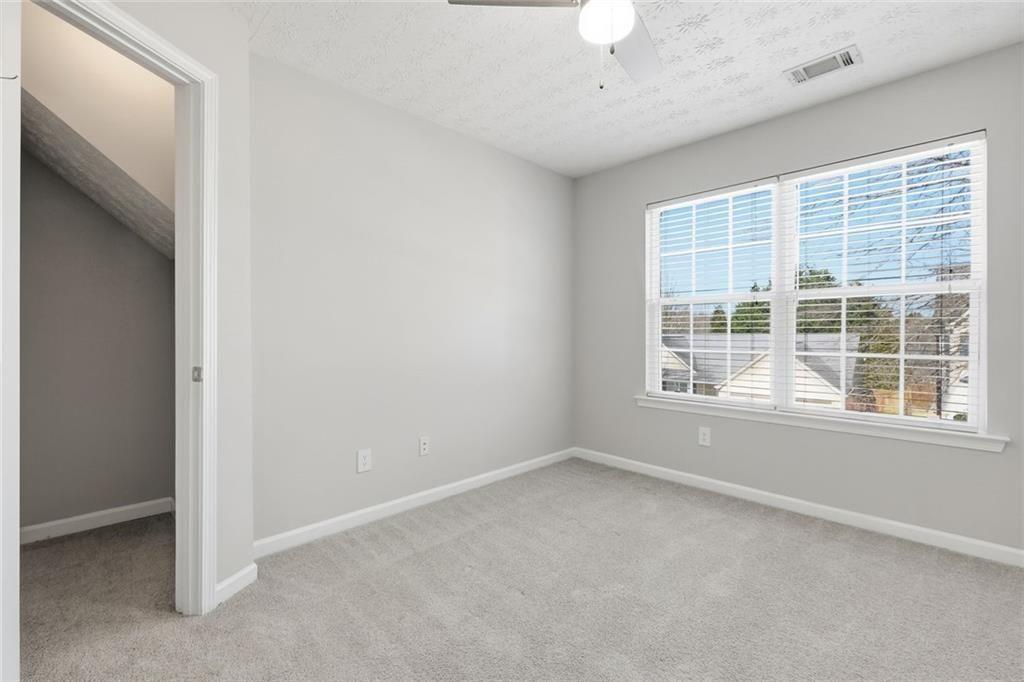 3570 Bogan Mill Road Northeast Buford, GA 30519 - Photo 23 of 31 an empty room with a window