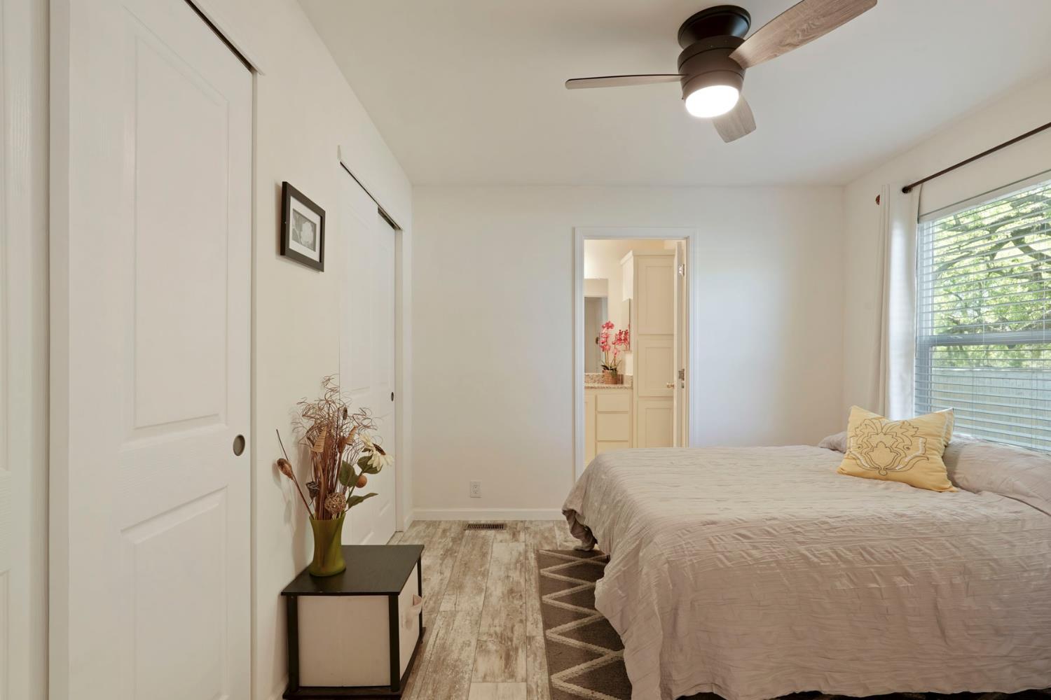 19250 North Lower Sacramento Road, Unit 22 Woodbridge, CA 95258 - Photo 12 of 30 a bedroom with a bed and a dresser