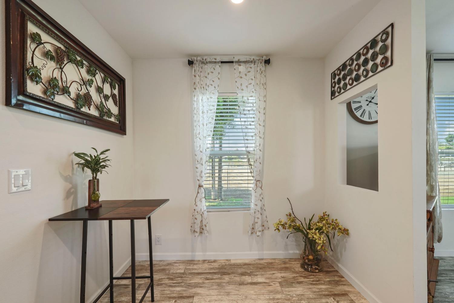 19250 North Lower Sacramento Road, Unit 22 Woodbridge, CA 95258 - Photo 20 of 30 a view of a room with a table and chairs
