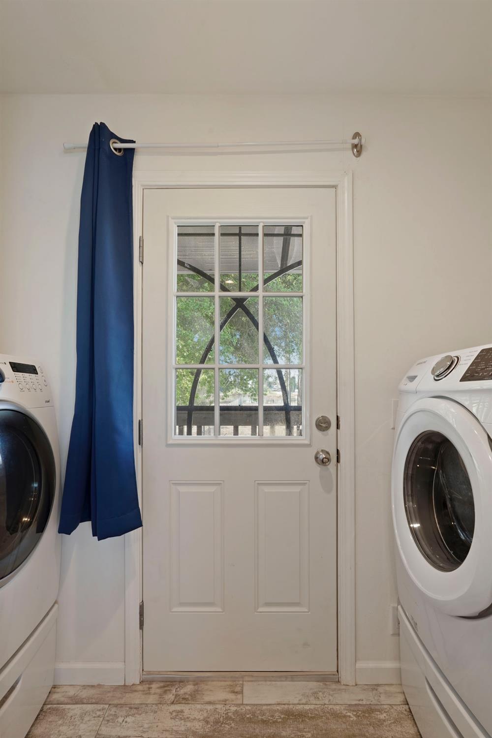 19250 North Lower Sacramento Road, Unit 22 Woodbridge, CA 95258 - Photo 21 of 30 a utility room with dryer and washer