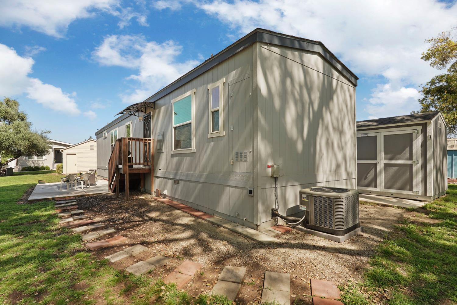 19250 North Lower Sacramento Road, Unit 22 Woodbridge, CA 95258 - Photo 23 of 30 a view of a house with a yard
