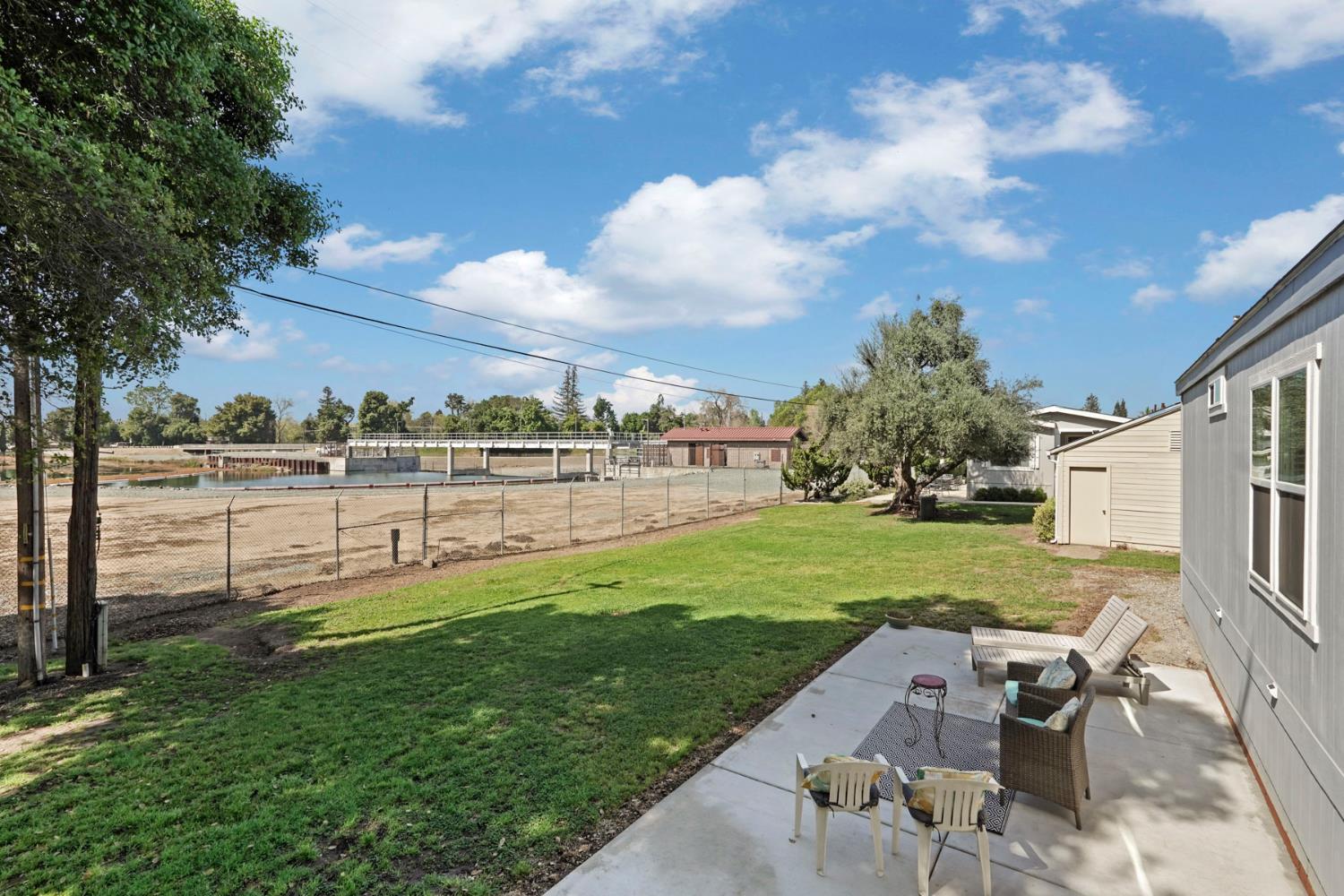 19250 North Lower Sacramento Road, Unit 22 Woodbridge, CA 95258 - Photo 26 of 30 a view of a garden with an outdoor seating