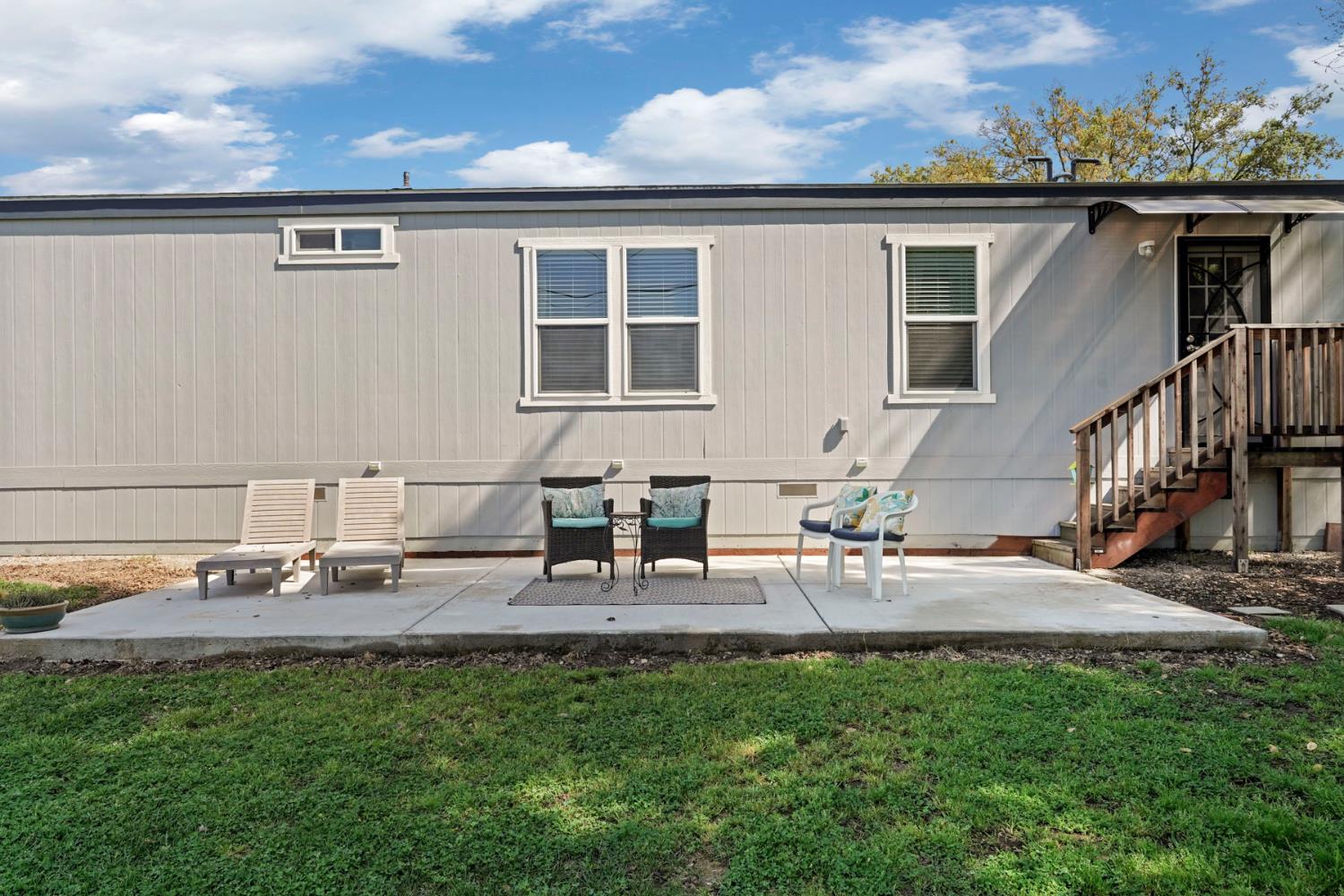 19250 North Lower Sacramento Road, Unit 22 Woodbridge, CA 95258 - Photo 27 of 30 a view of backyard of the house with seating space
