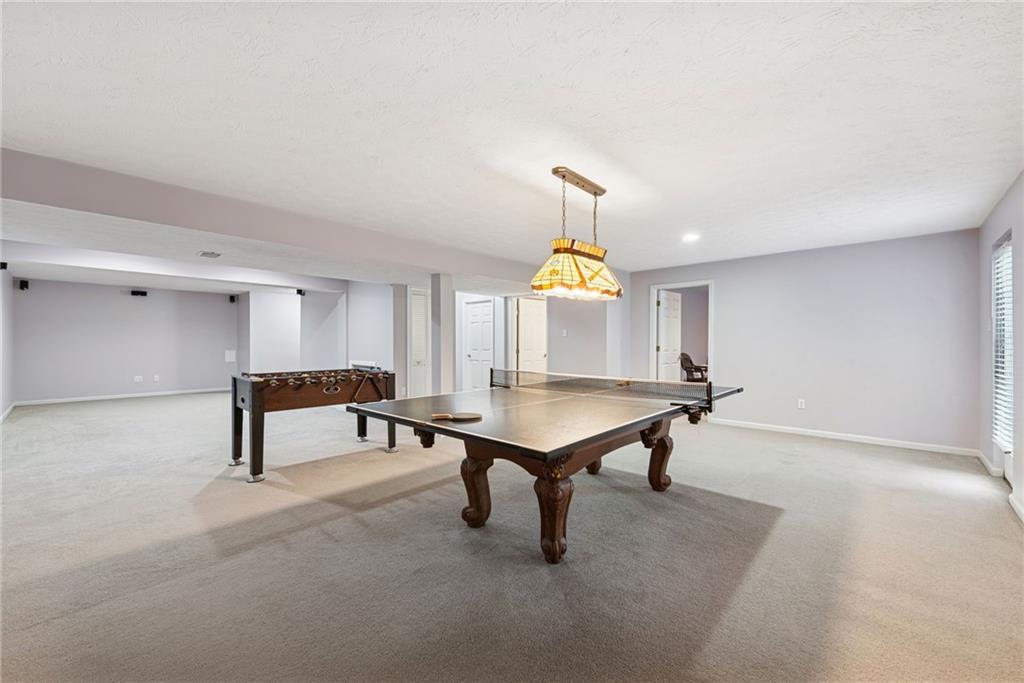 504 Azalea Lane Bridgeville, PA 15017 - Photo 26 of 34 Expansive game room with projector screen and components