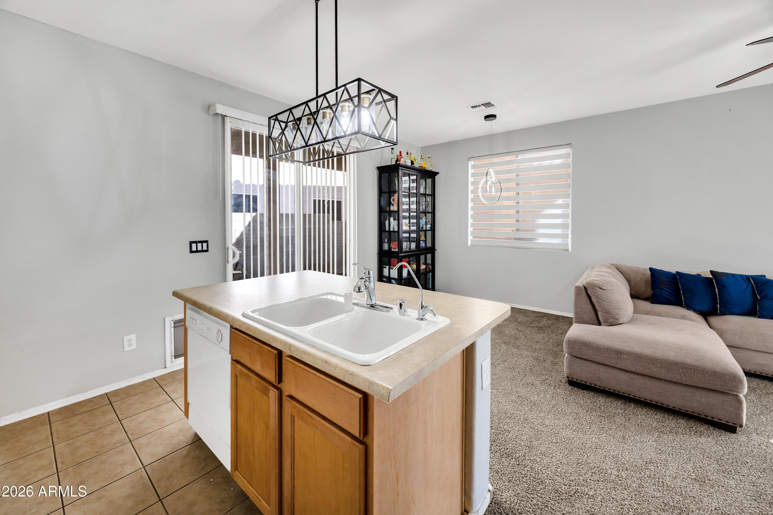 1430 East Romley Road Phoenix, AZ 85040 - Photo 11 of 24 a view of kitchen and living room