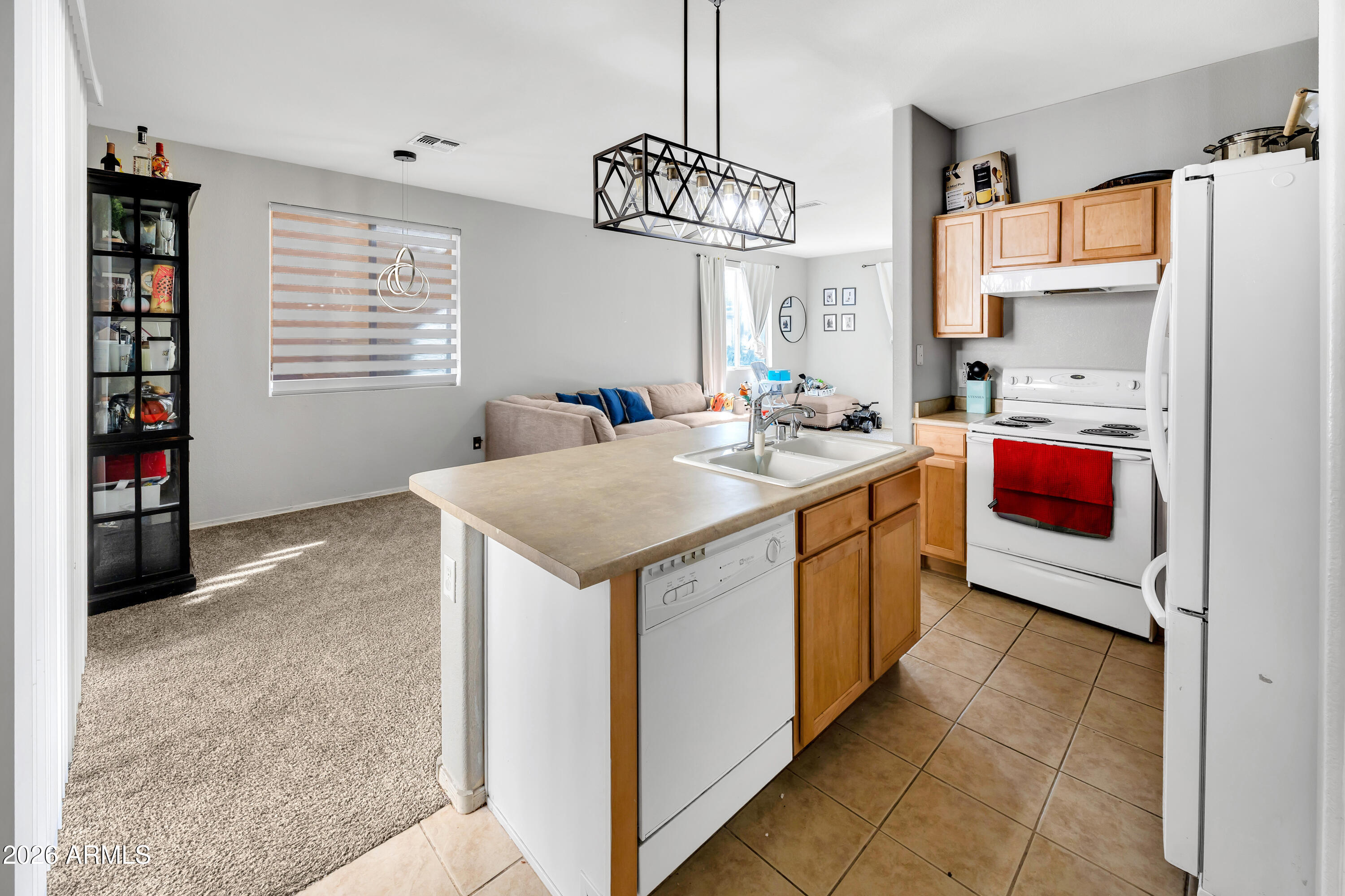 1430 East Romley Road Phoenix, AZ 85040 - Photo 12 of 24 a utility room with stainless steel appliances granite countertop a sink dishwasher and cabinets with wooden floor