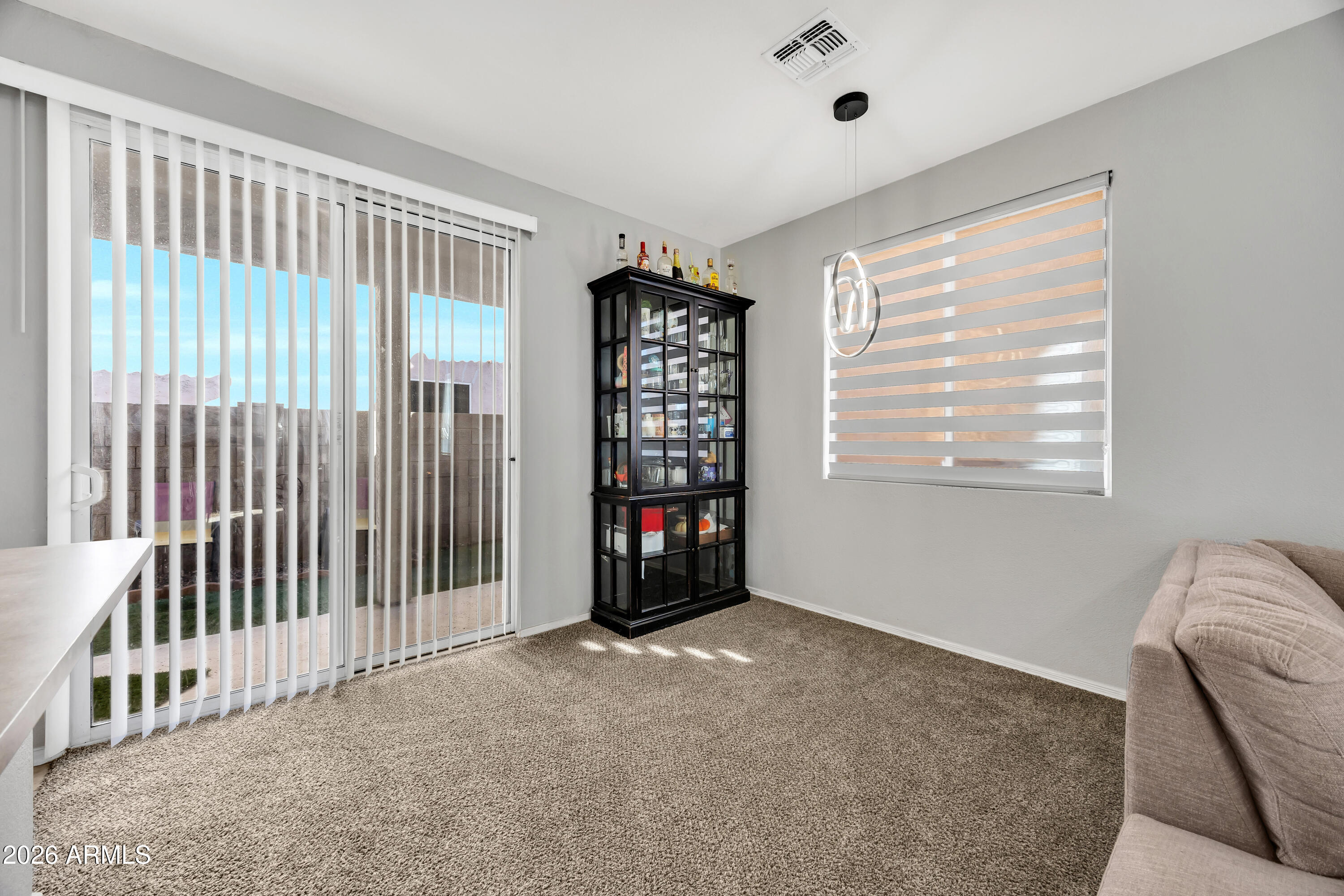 1430 East Romley Road Phoenix, AZ 85040 - Photo 13 of 24 a view of an empty room with a window