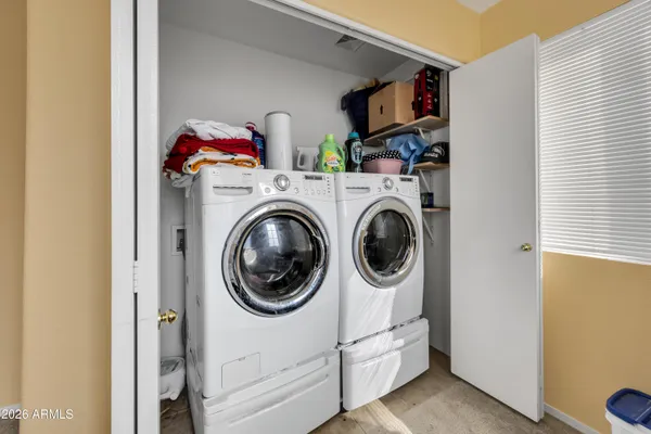 a utility room with dryer and washer