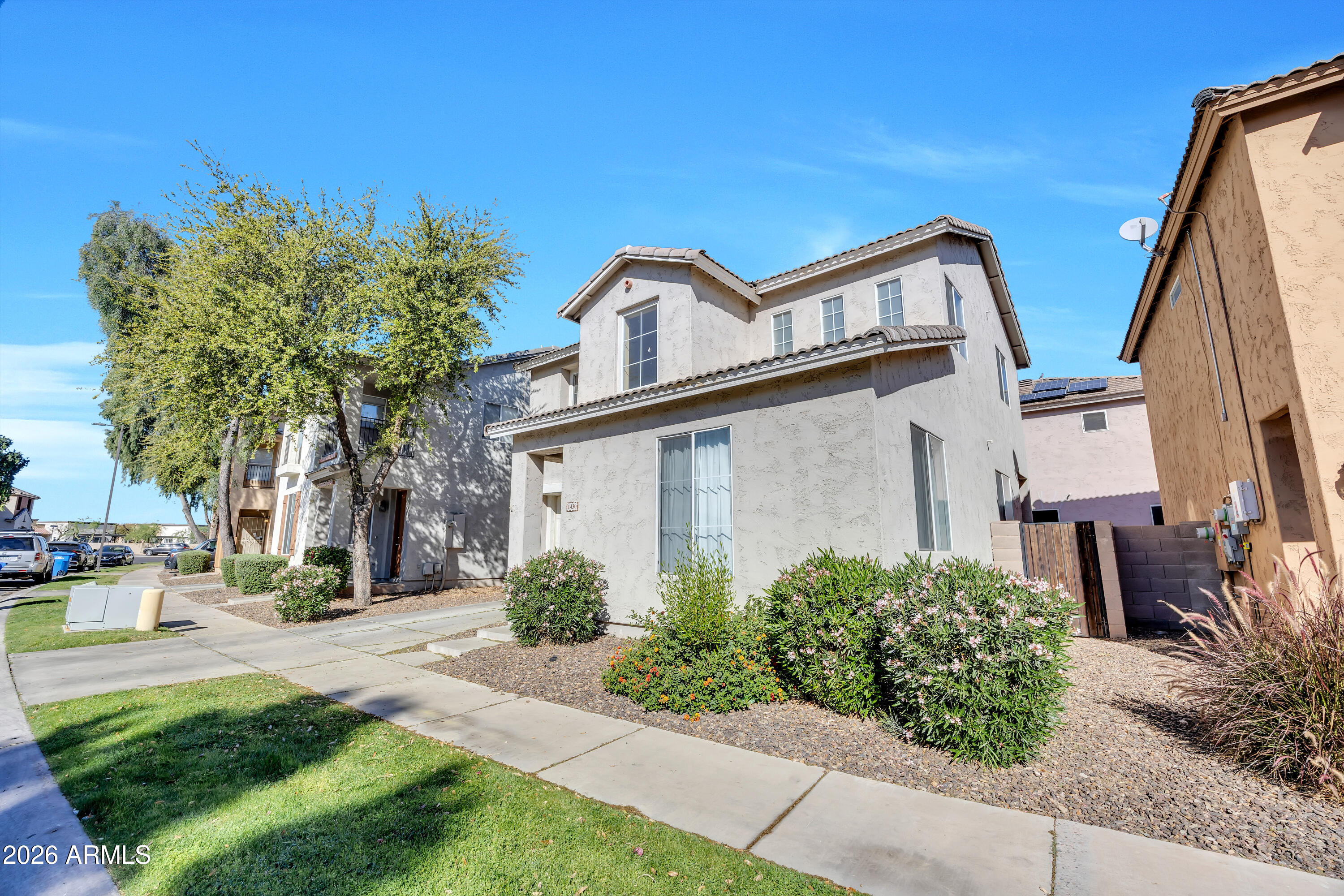 1430 East Romley Road Phoenix, AZ 85040 - Photo 3 of 24 a view of a house with a street