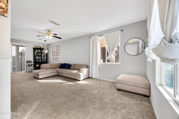 a living room with furniture and a large window
