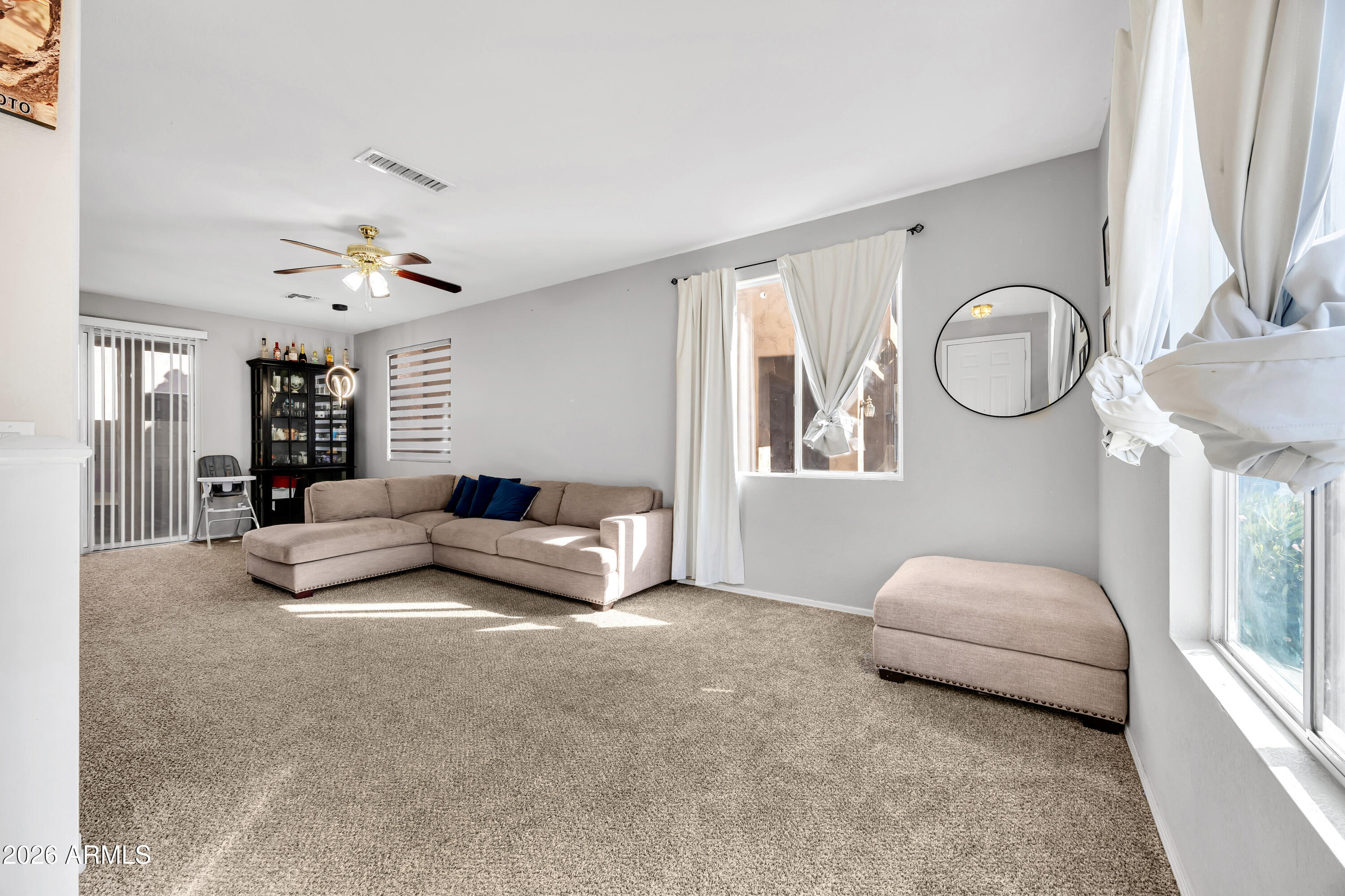 1430 East Romley Road Phoenix, AZ 85040 - Photo 7 of 24 a living room with furniture and a large window