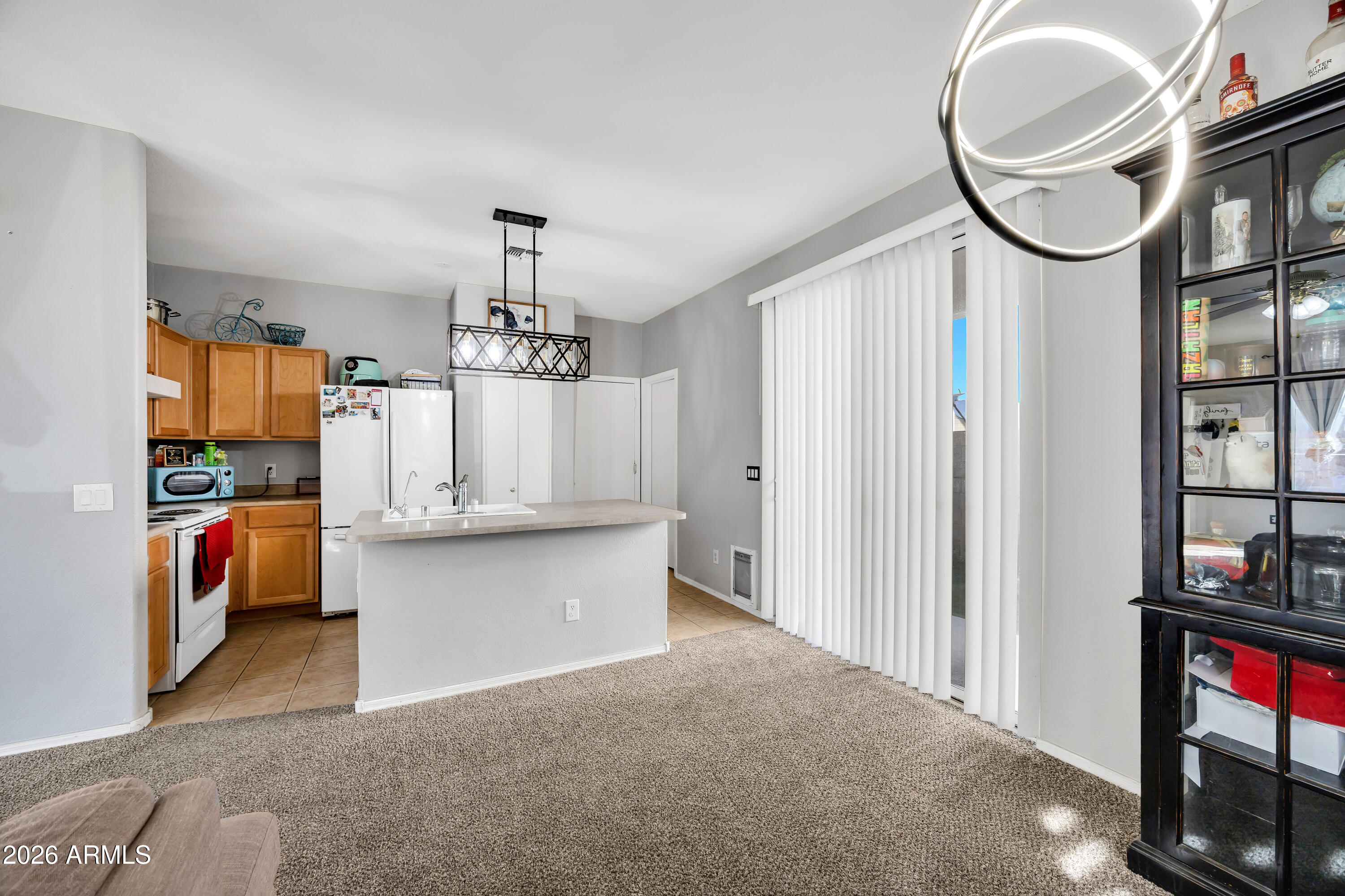 1430 East Romley Road Phoenix, AZ 85040 - Photo 9 of 24 a kitchen with stainless steel appliances granite countertop a white cabinets and a sink