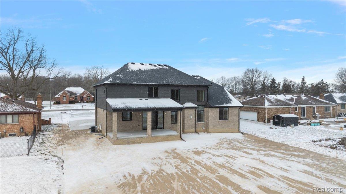 53650 Romeo Plank Road Macomb, MI 48042 - Photo 57 of 64 Rear of property with a patio and brick siding