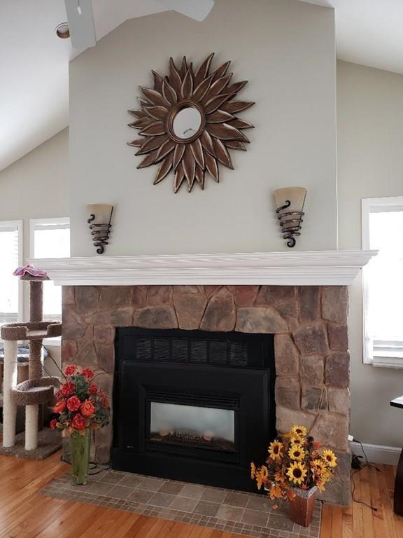 12 Hemlock Road Boxford, MA 01921 - Photo 15 of 42 a kitchen with a fireplace and a potted plant